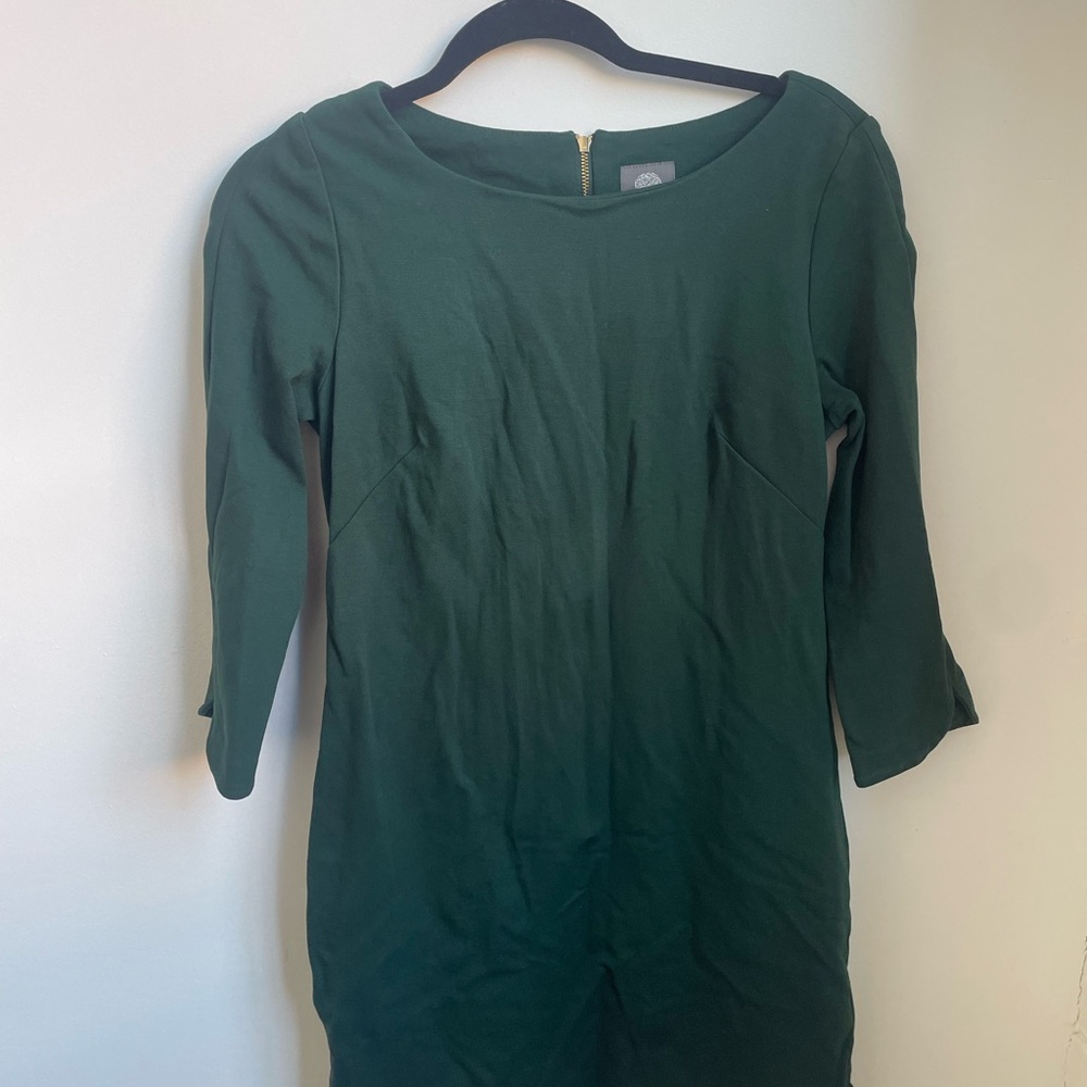 Elegant emerald green dress with gold zipper body con style